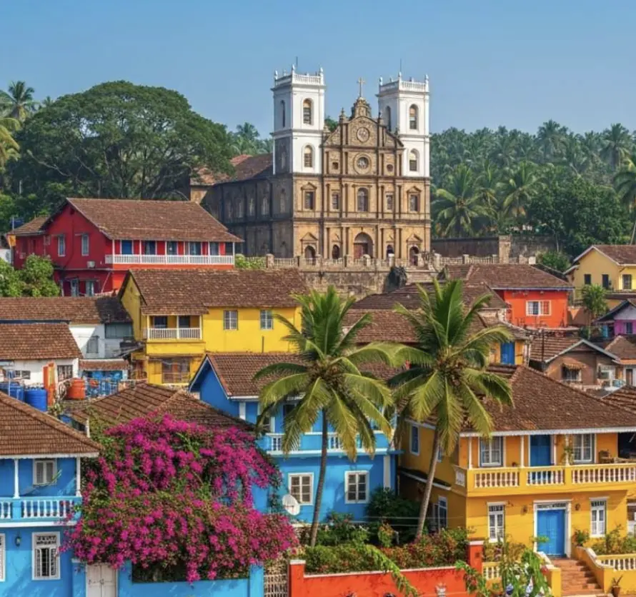 Colorful houses of Panjim beneath a Portuguese-era church, Goa